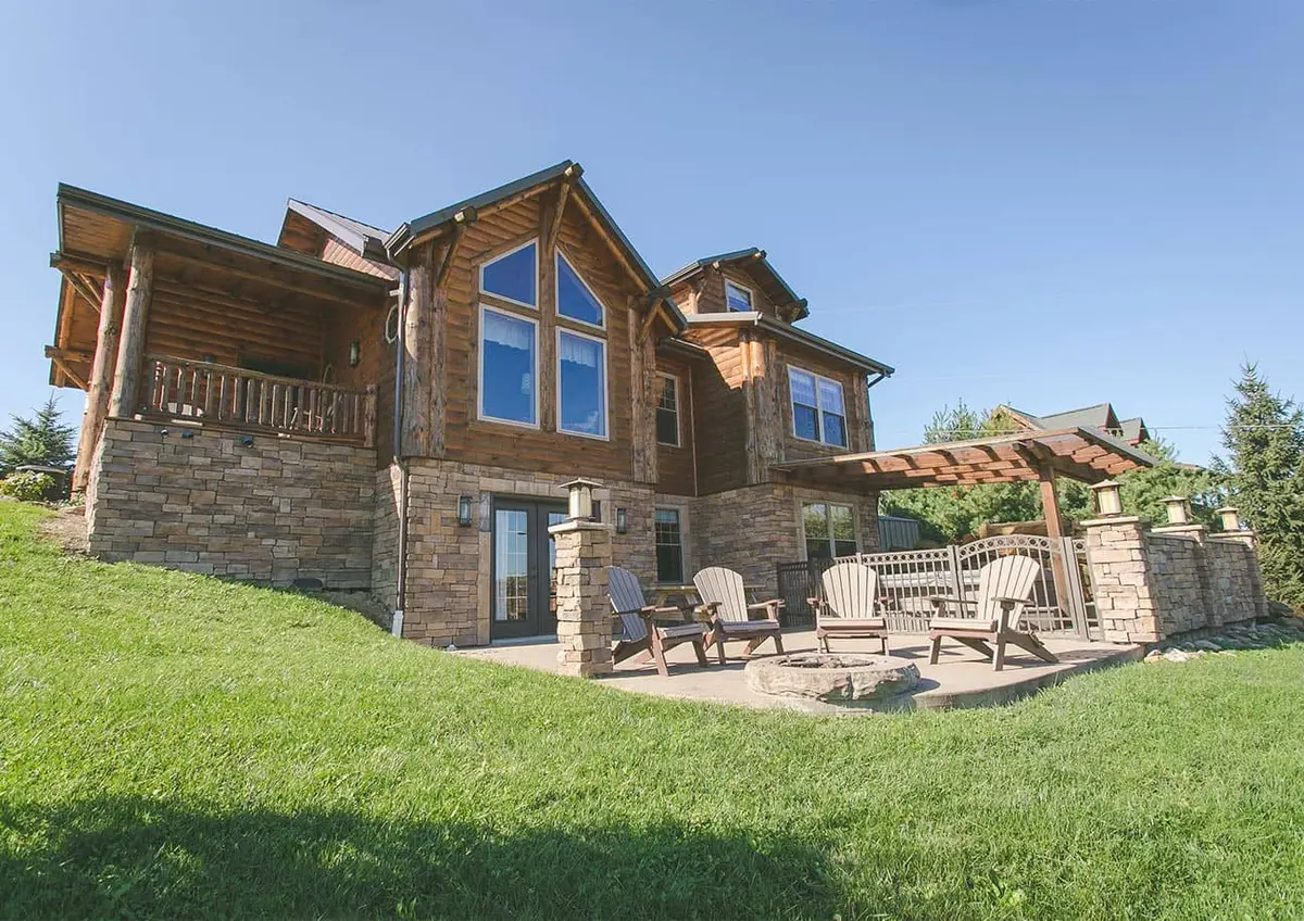 Cabin porch with hillside pond views at Coblentz Country Cabins